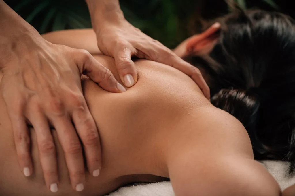 Deep tissue massage targeting back muscles with focused pressure