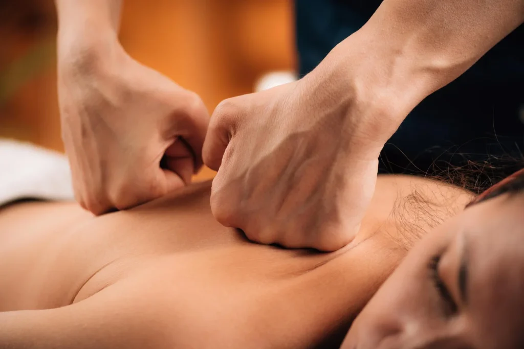 Therapist using hands-on soft tissue techniques on a client's back
